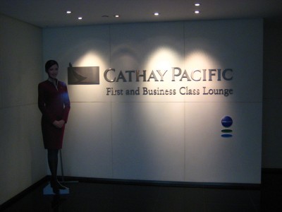 a woman standing in front of a sign