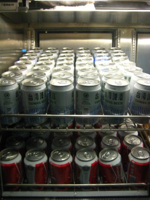 a group of cans in a refrigerator
