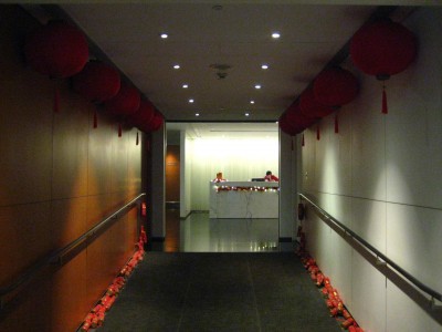 a long hallway with red lanterns