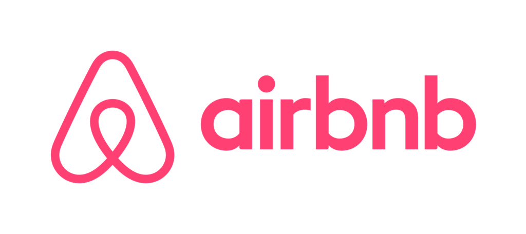 a pink logo with a drop of water