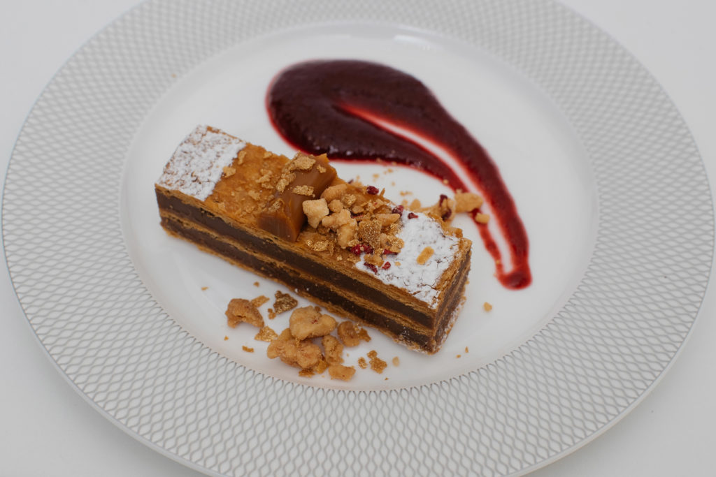 a plate of dessert on a white surface