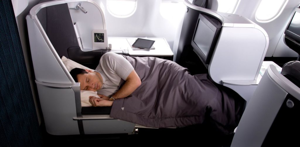 a man sleeping in a plane