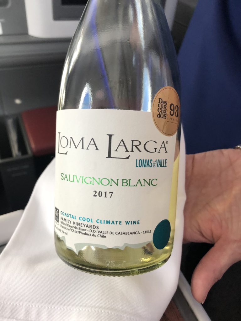 a bottle of wine on a plane