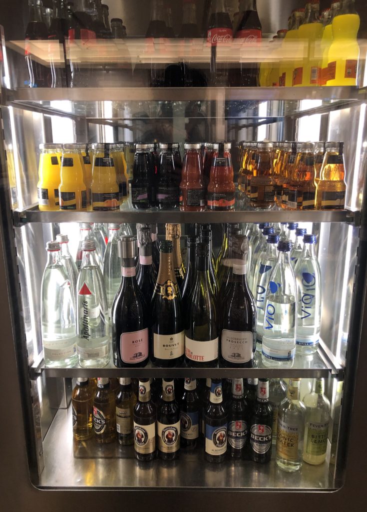 a shelf of bottles and drinks