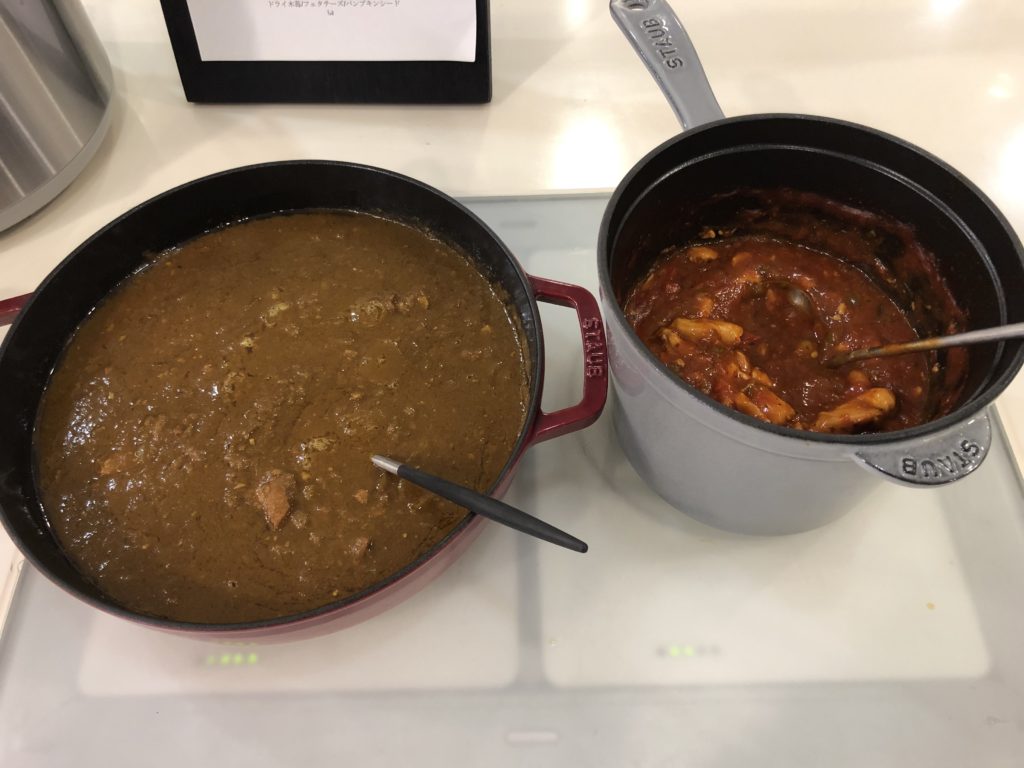 two pots with food in them