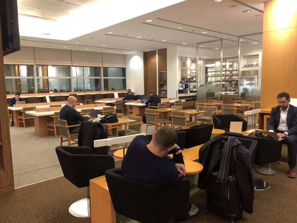 a group of people sitting in chairs in a library