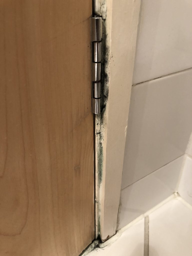 a door hinge on a wall