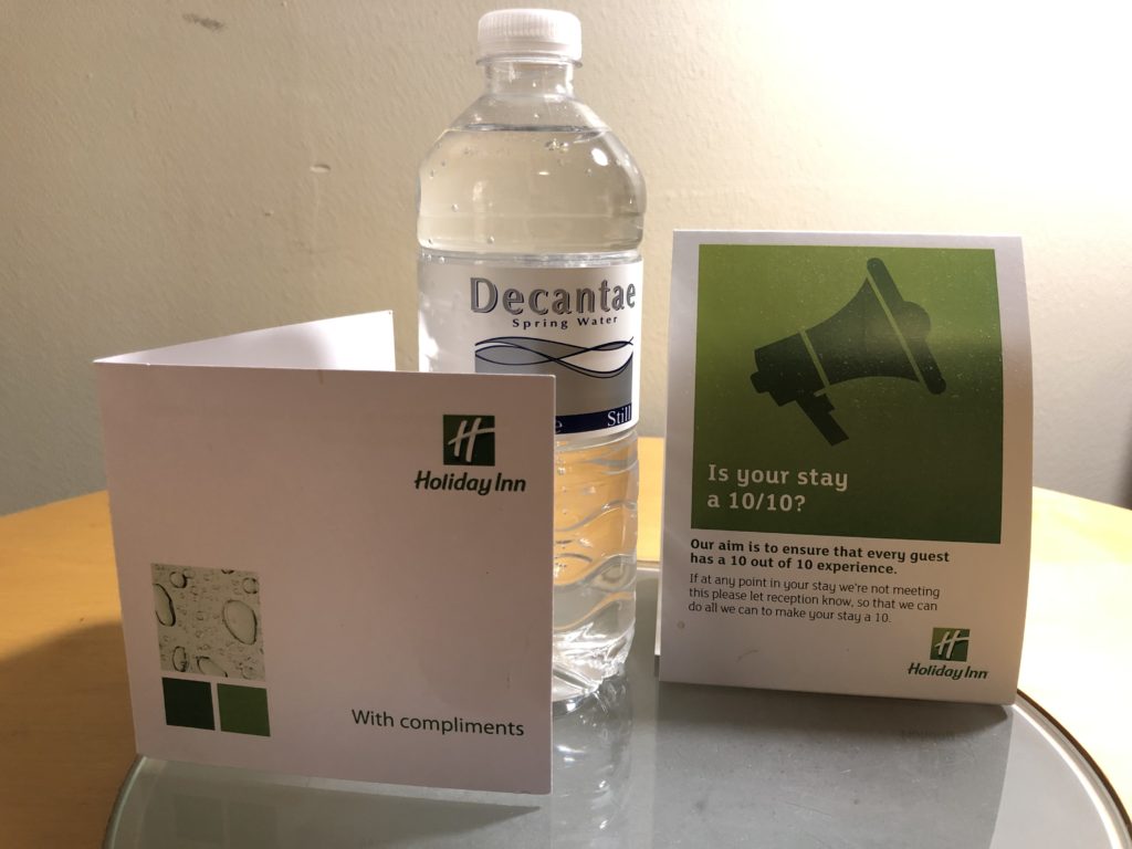 a water bottle and a card