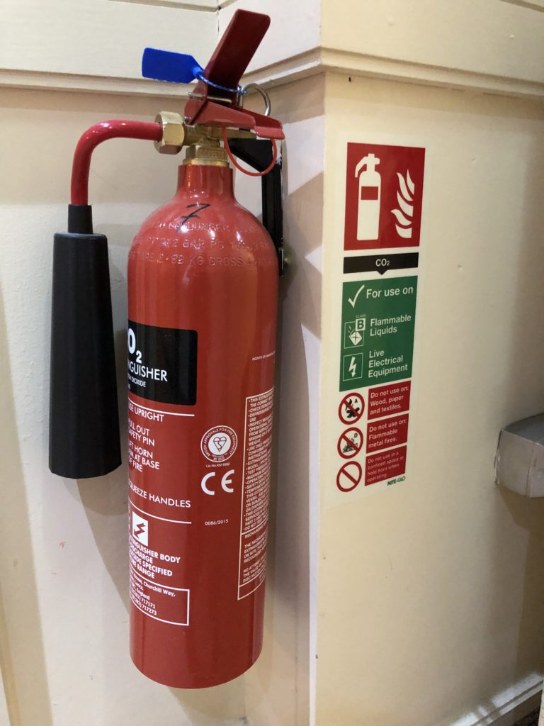 a fire extinguisher on a wall
