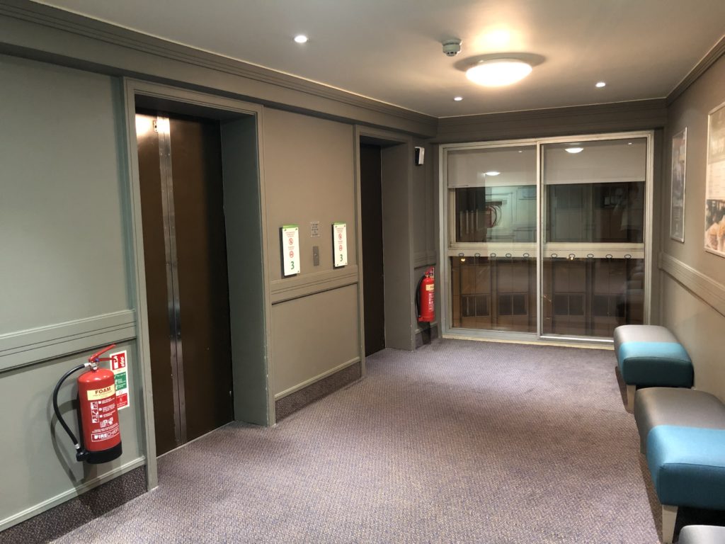 an elevator with a fire extinguisher