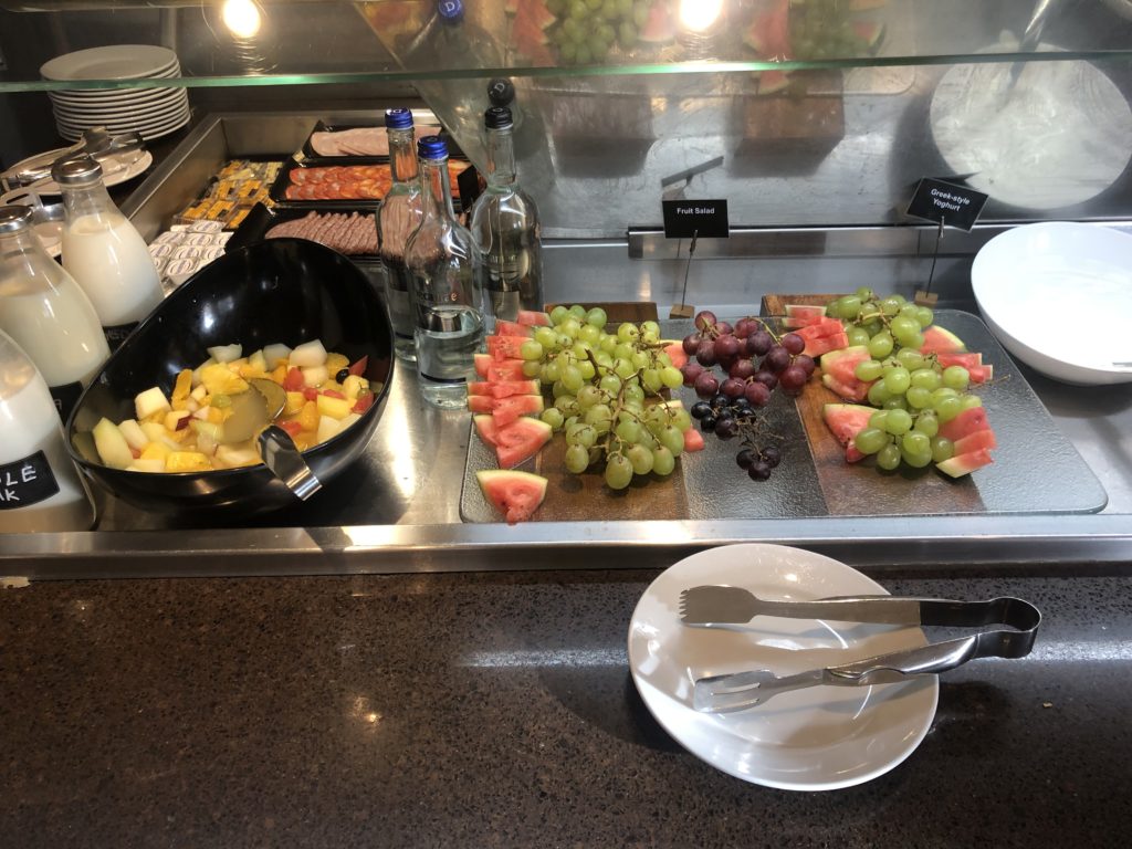 a buffet table with fruit and vegetables