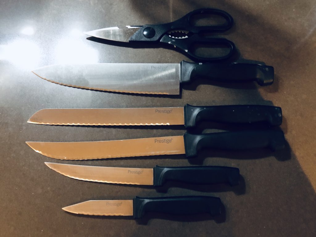 a group of knives and scissors