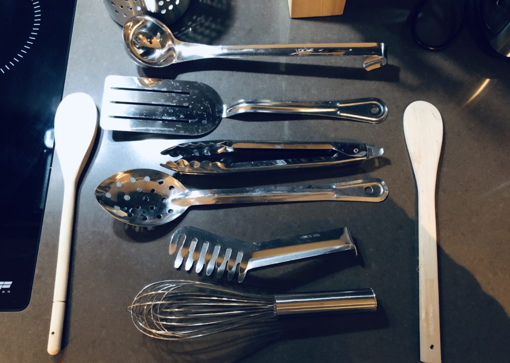 a group of kitchen utensils on a counter