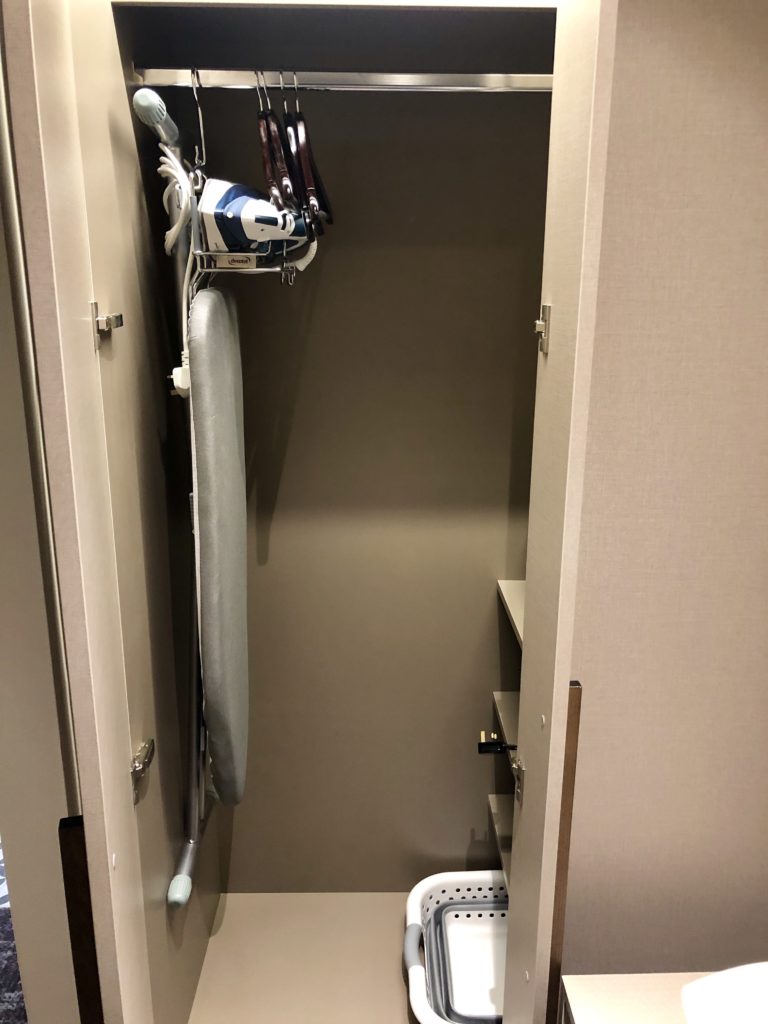 ironing board and ironing board in a closet