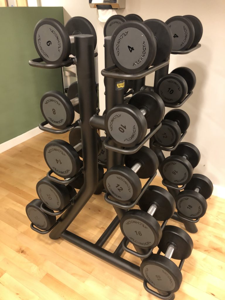 a set of weights on a rack