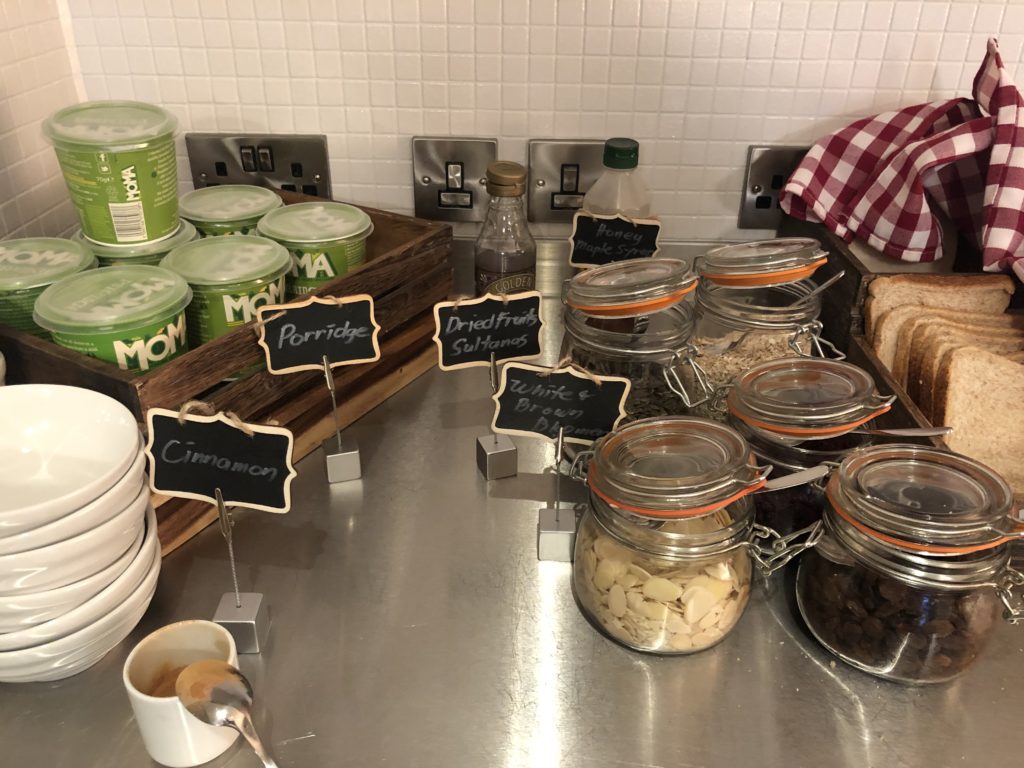 a counter with jars of food and labels