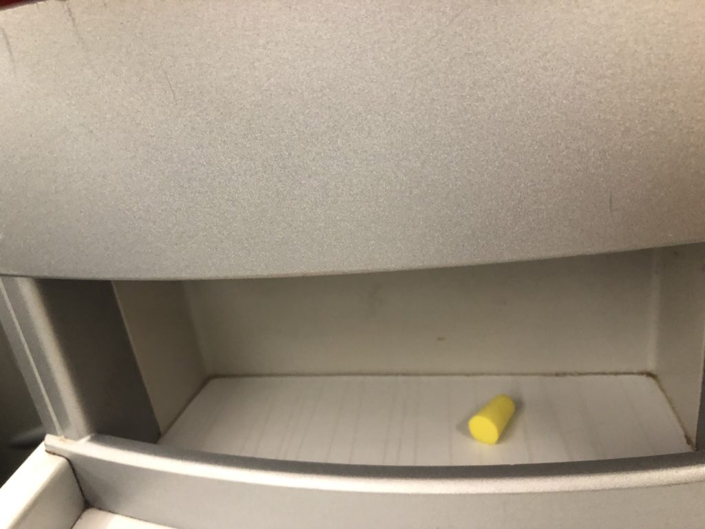 a yellow object on a shelf