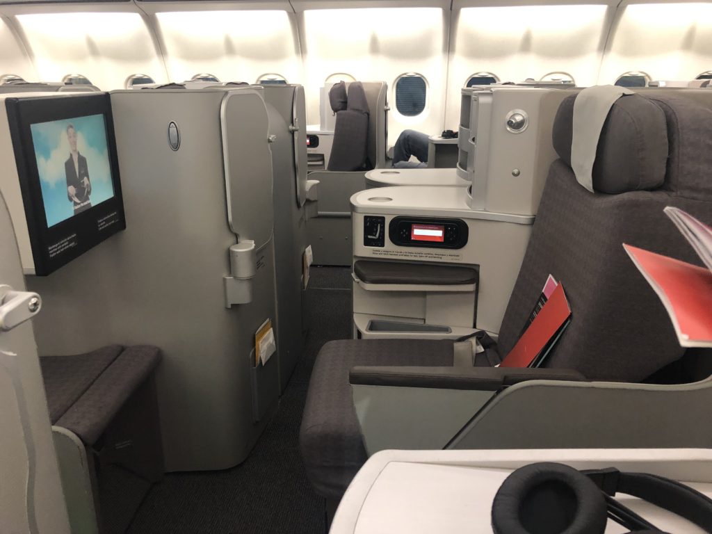 a plane with seats and a monitor