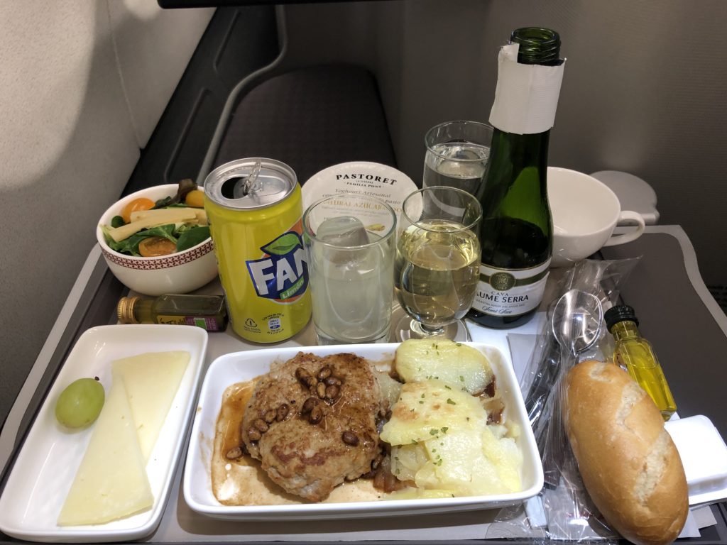food on a tray with drinks and food on it