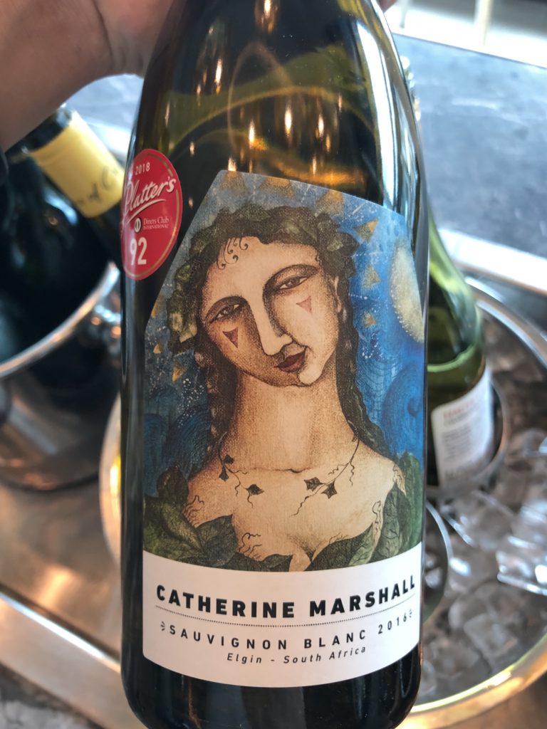 a bottle of wine with a woman on it