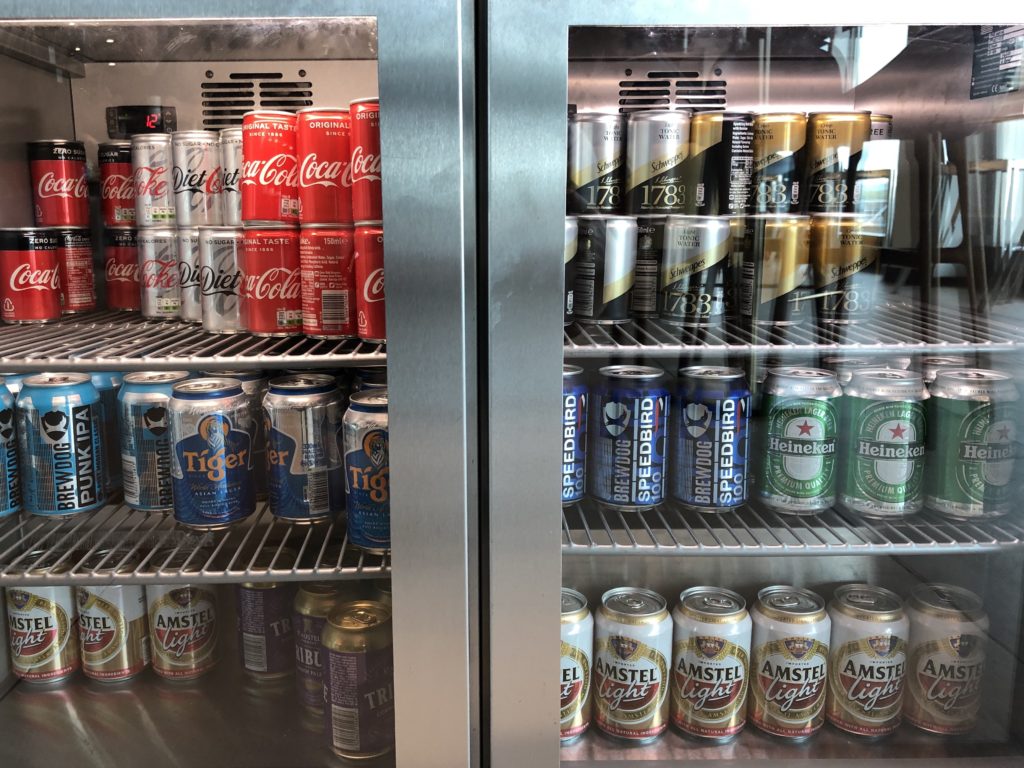 a refrigerator with cans of beer